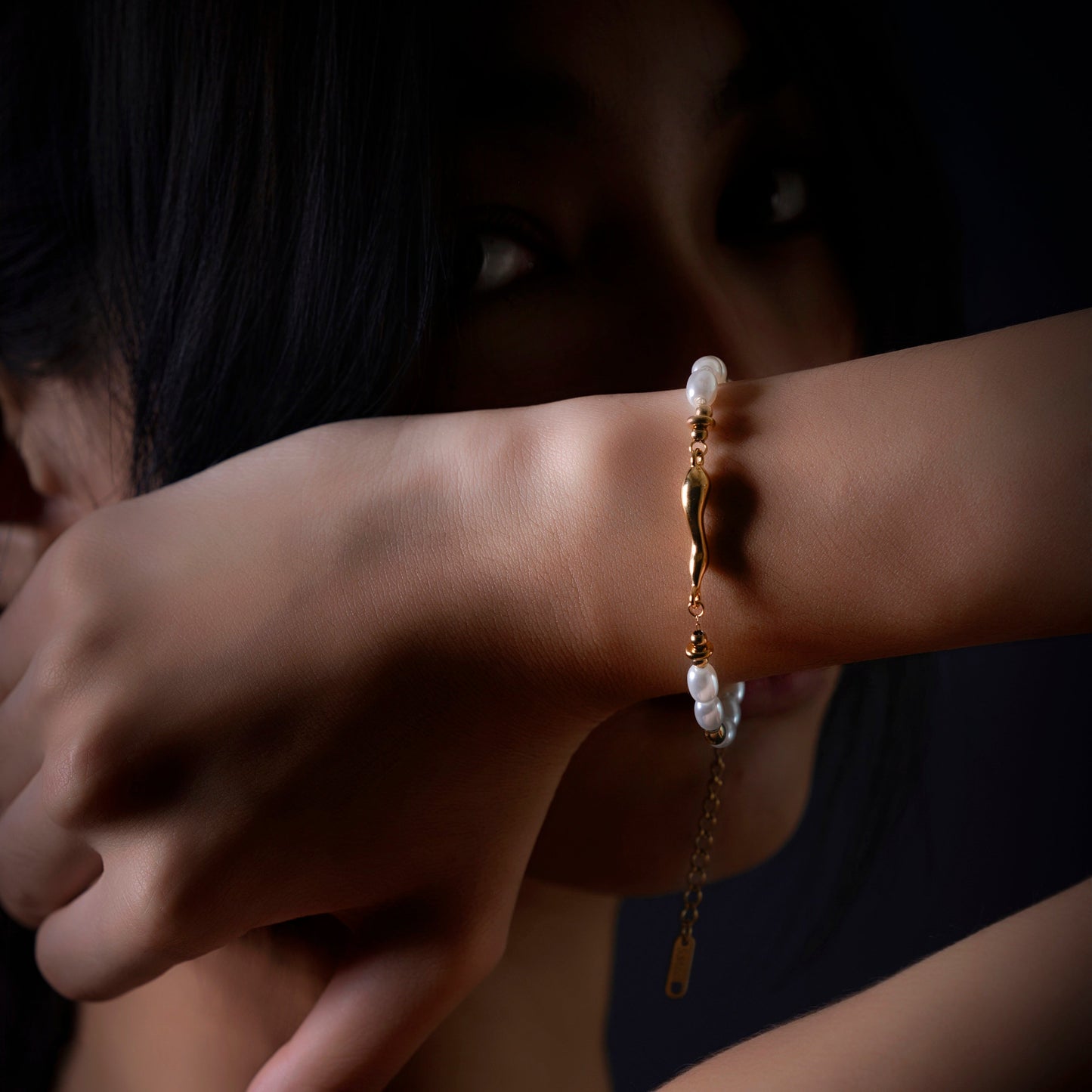 First Light pearl-effect bracelet worn on the wrist