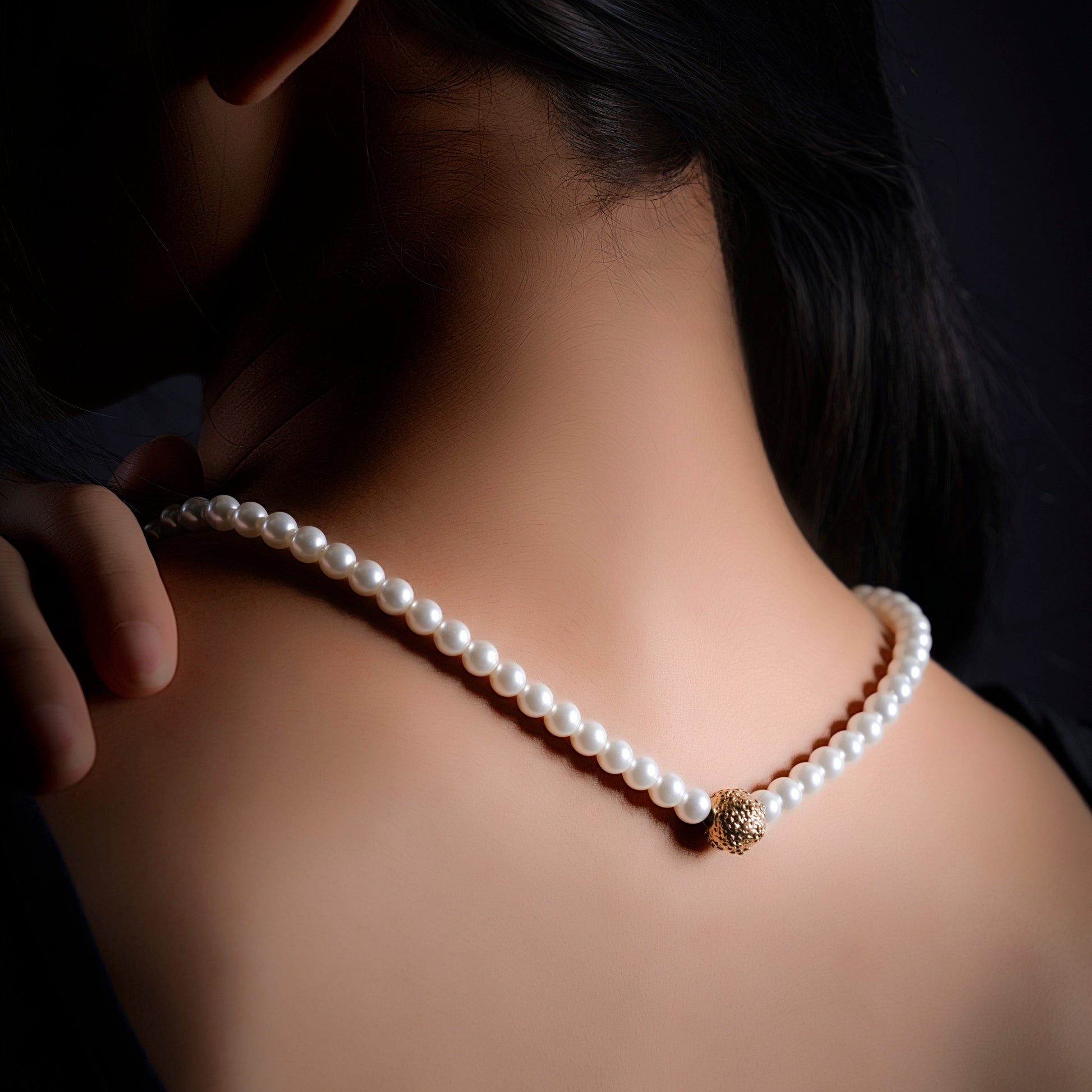 First Light pearl-look necklace worn at the neckline